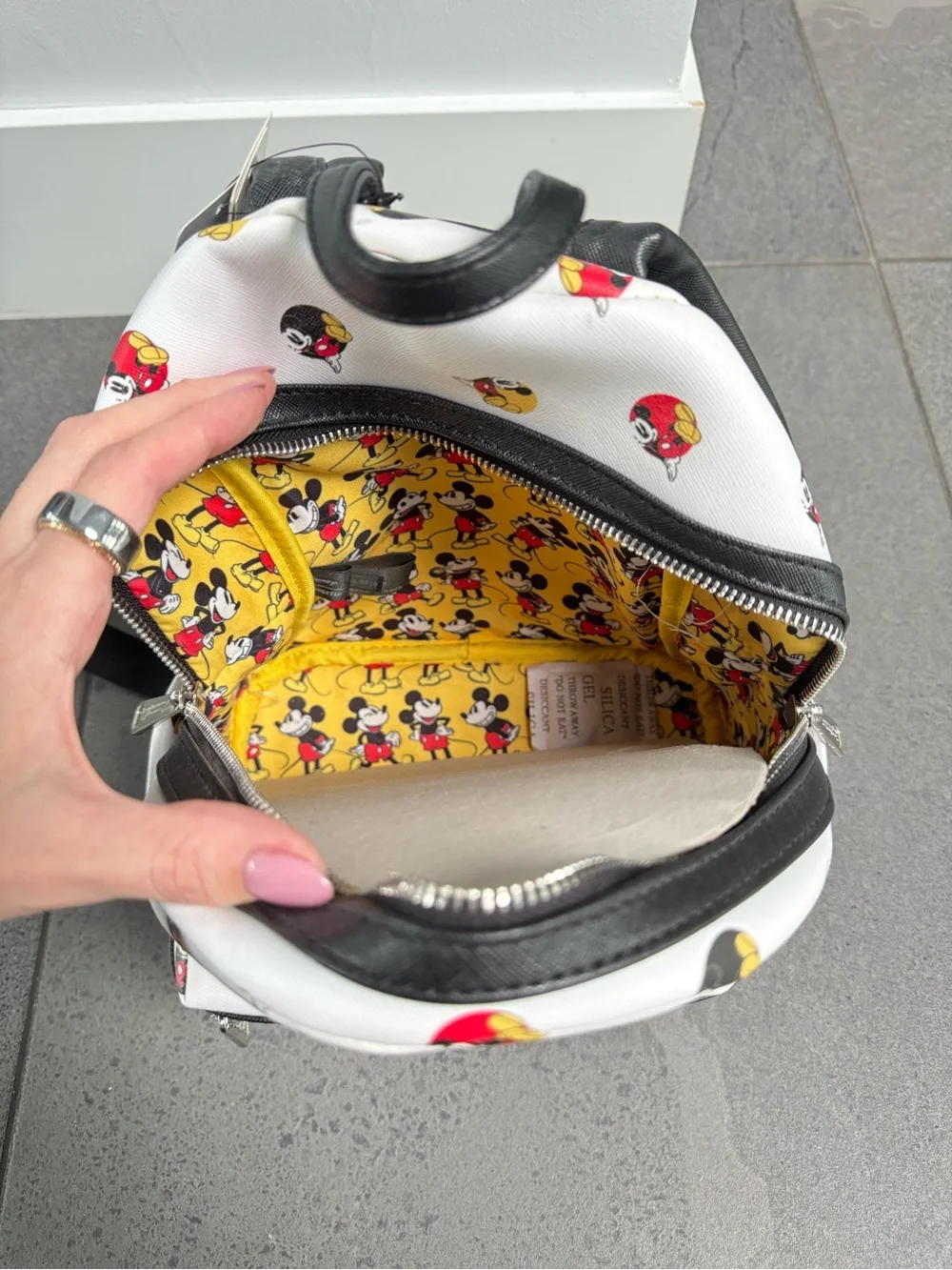 Loungefly Disney White Mini Backpack with Red and Yellow Mickey Icons